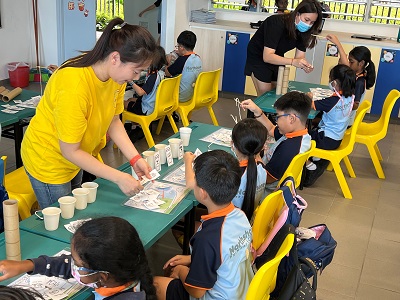 Children learning how to sort various recyclables during hands on activity.